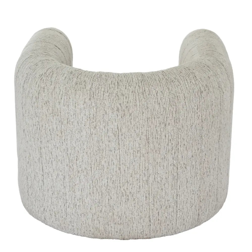 A cozy avia mist armchair with curved design and soft gray textured fabric featuring subtle vertical ribbing