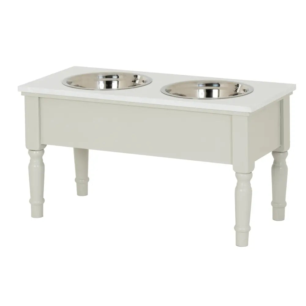 White wooden belmont collection pet feeder table with two shiny stainless steel pet feeder bowls