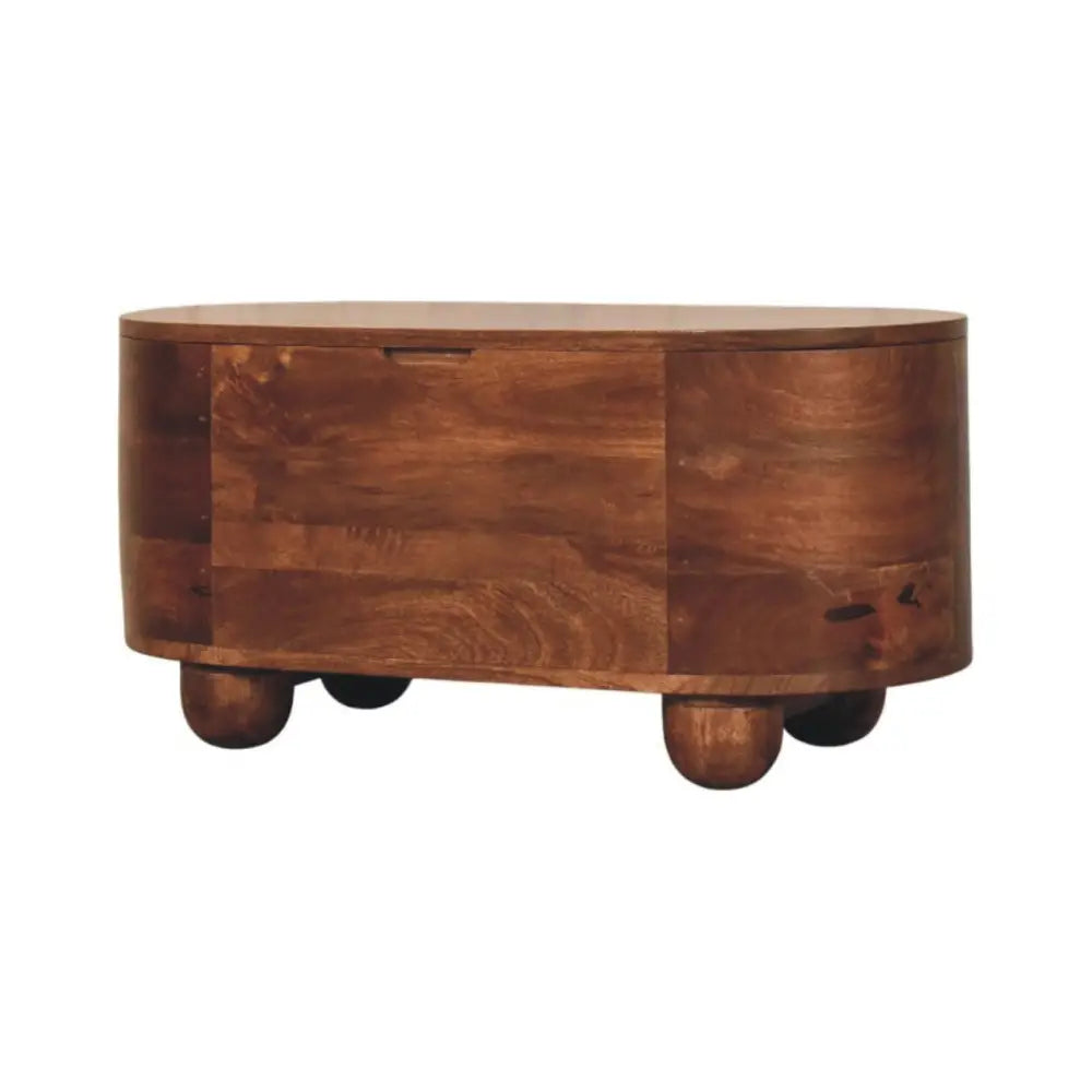 Curva storage trunk warm brown wooden coffee table with solid mango wood rounded top and small spherical feet