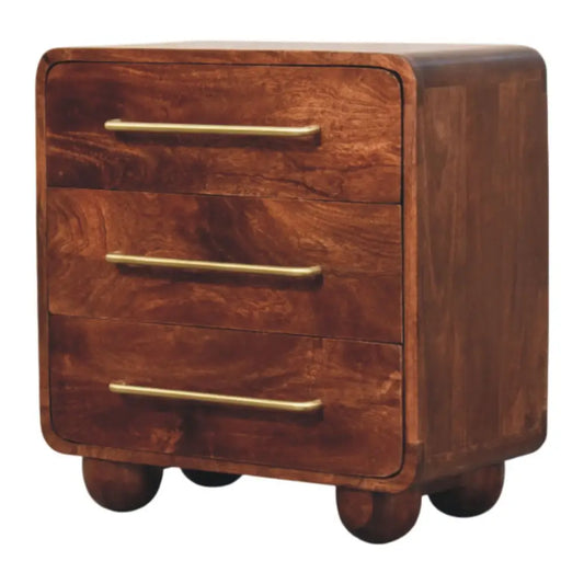 A sleek dark brown solid mango wood rounded chest nightstand with three drawers and brass handles