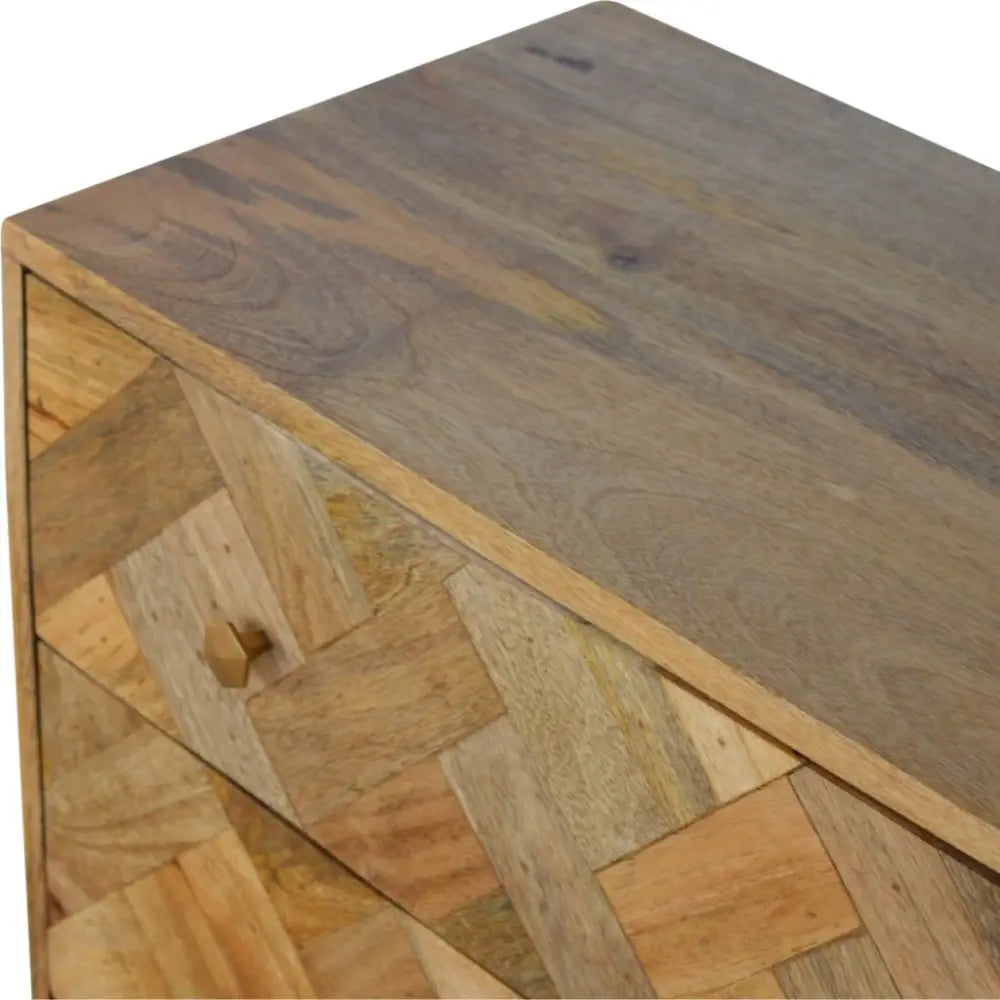 A rustic 3 drawer patchwork chest with zig zag herringbone pattern made of warm reclaimed wood
