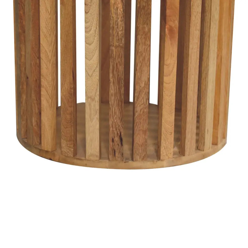 Ariella round dining table with cylindrical wooden side table featuring vertical slats in natural rustic wood