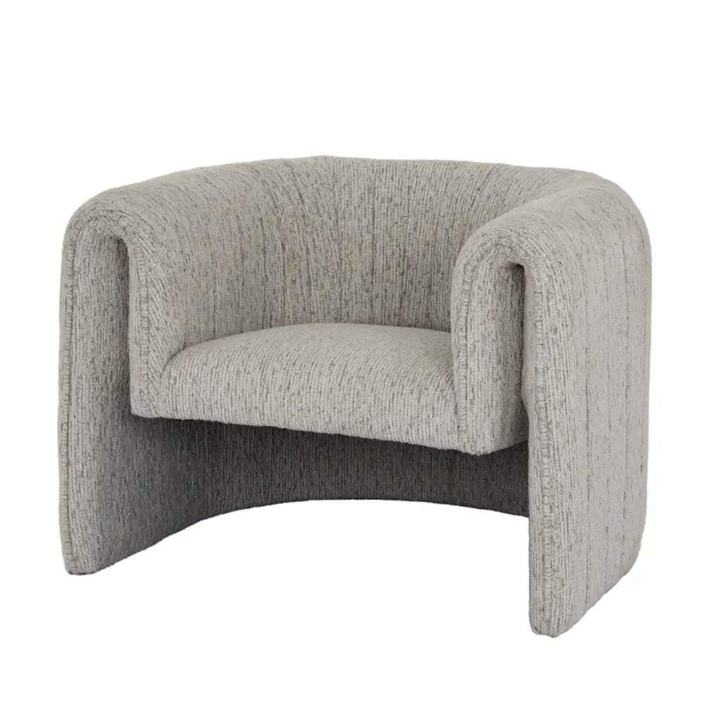 A sleek curved avia mist armchair upholstered in textured gray fabric with subtle vertical ribbing