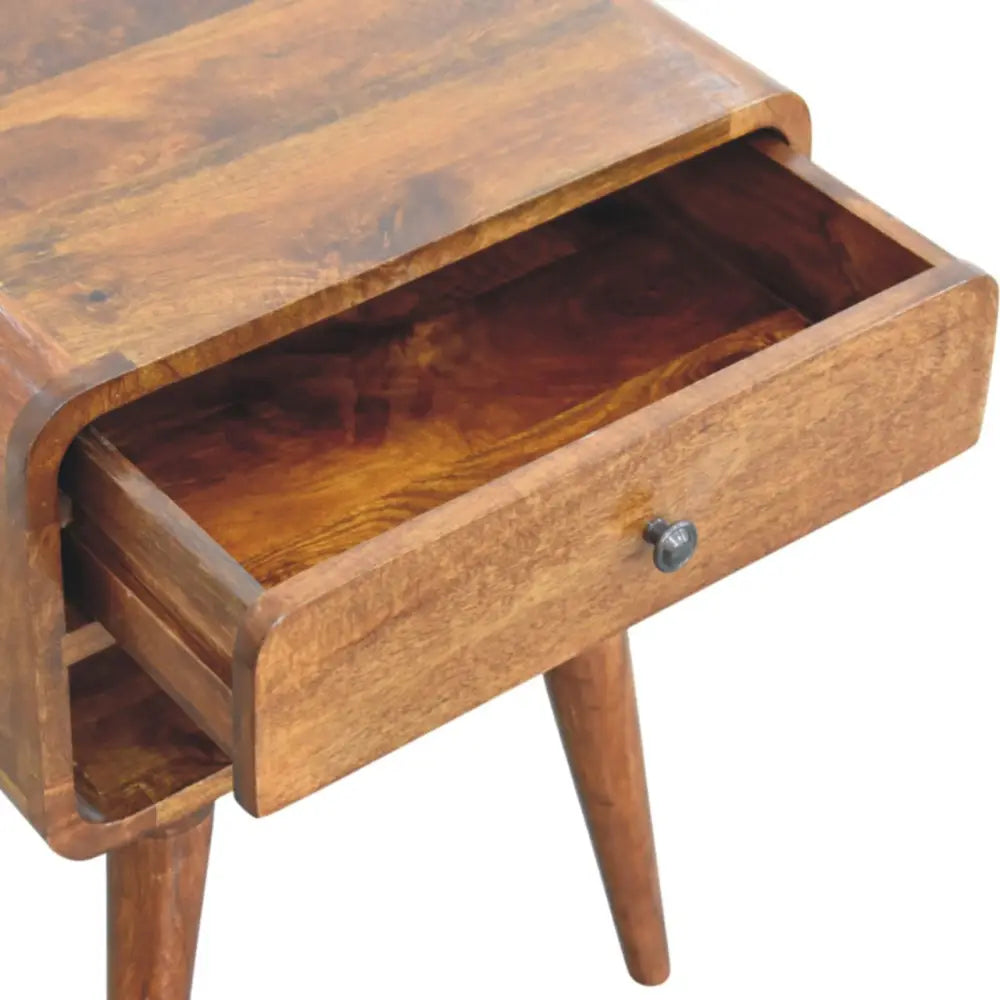 Avora chestnut nightstand with drawer and open slot in warm mango wood with tapered legs and medium tone finish