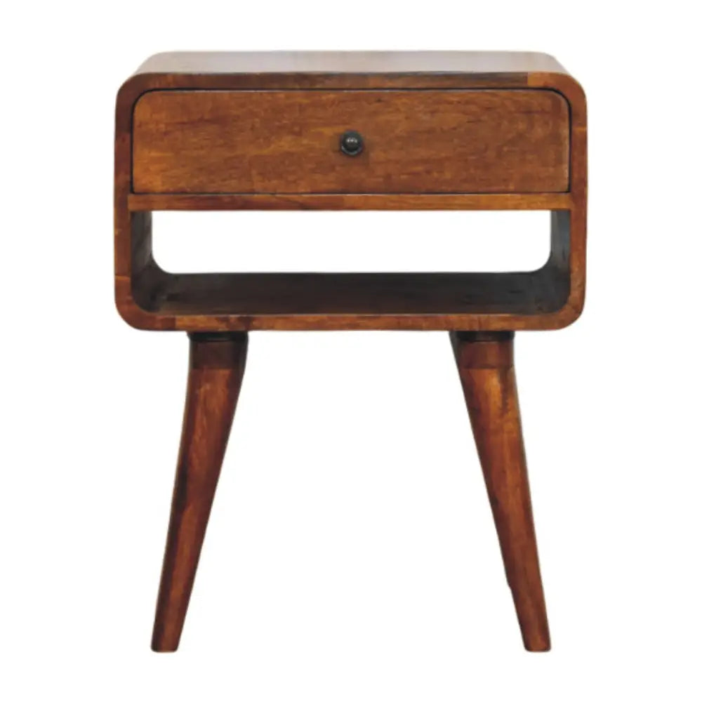 Thora chestnut nightstand with drawer and open slot in solid mango wood with tapered legs and a gold-toned lamp on top