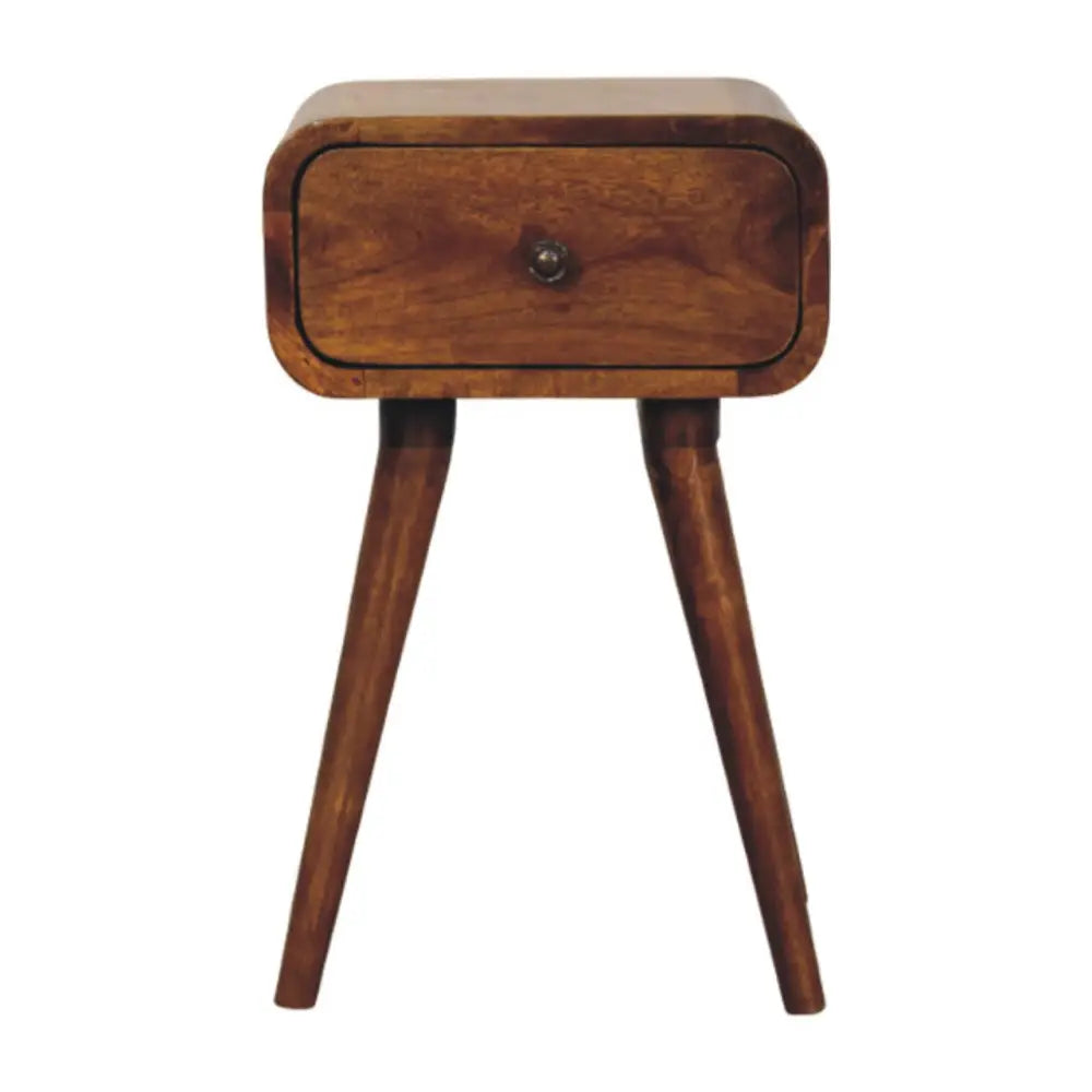 A sleek avora mini chestnut nightstand with one drawer made of solid mango wood and tapered legs