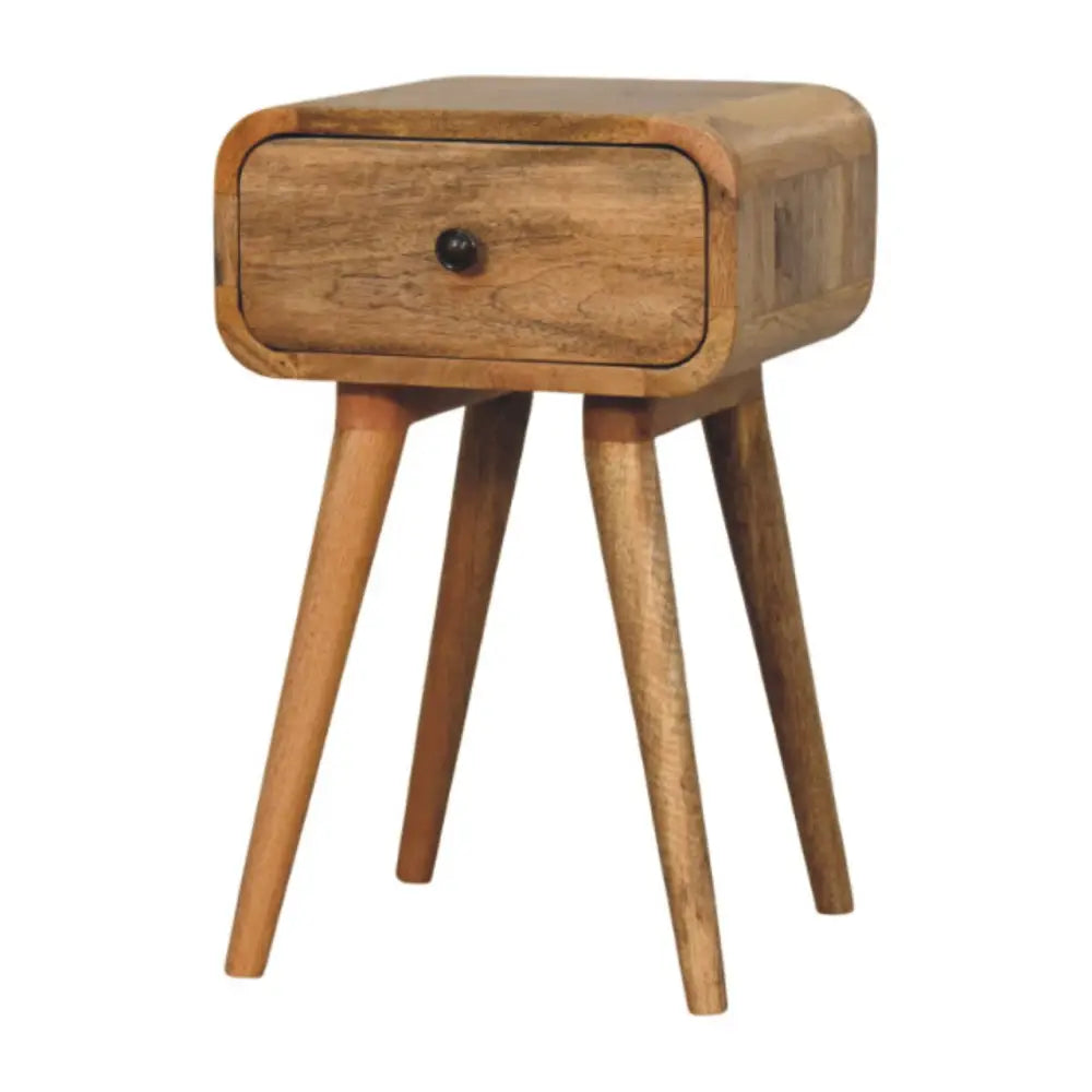 Light brown avora mini oak-ish nightstand with one drawer and tapered legs made from solid mango wood