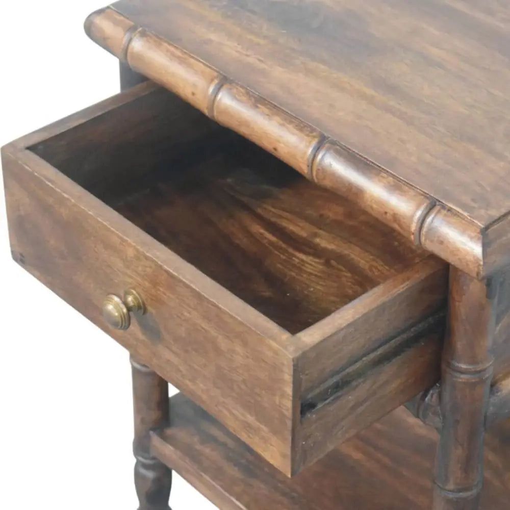 Dark brown bamboo carved bedside table with bamboo style legs and brass knob made from solid mango wood