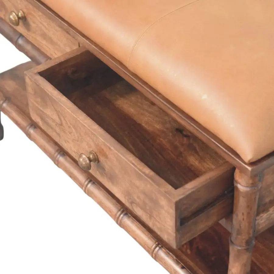 Tan leather-upholstered bamboo carved storage bench with two drawers and solid mango wood frame and brass knobs