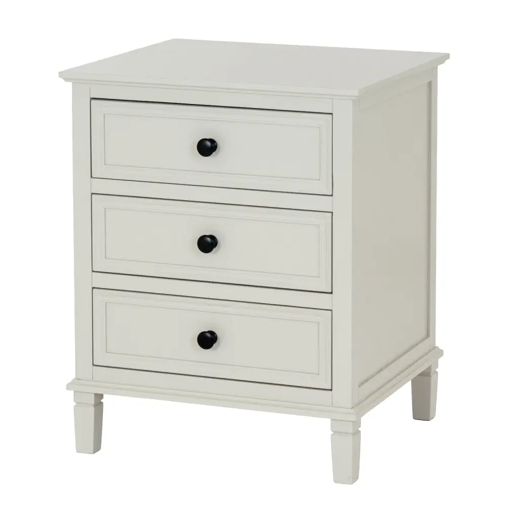 White three-drawer drawer bedside table from belmont collection with black round knobs and tapered legs