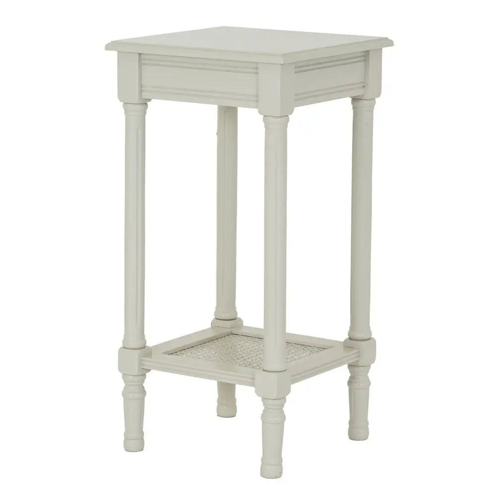 Off-white belmont rattan collection side table with cane-woven lower shelf and turned wooden legs