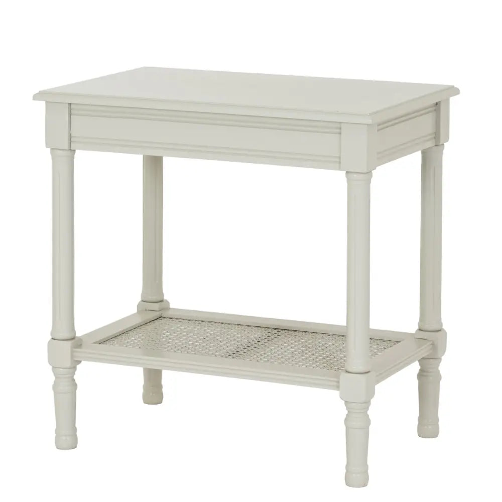 Off-white belmont rattan collection end table with cane-woven lower shelf and turned wooden legs