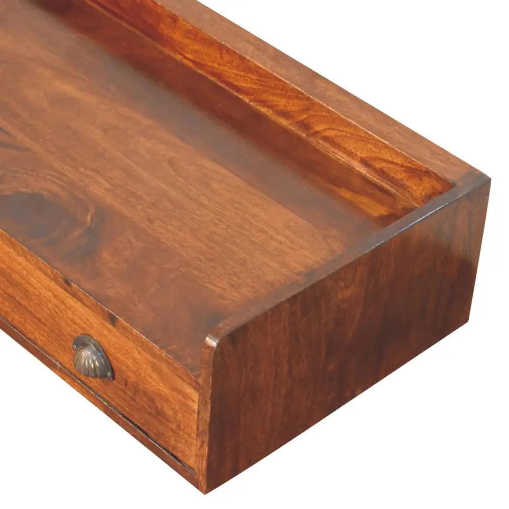 Belmont wall-mounted console shelf with a rich warm-toned wooden drawer and decorative shell-shaped metal pull