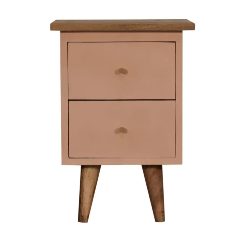 A hand painted blush pink two drawer nightstand with a wooden top and tapered legs perfect for bedside use