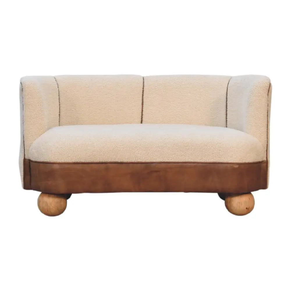 Boucle cream buffalo small sofa with plush cream fabric, brown leather base, and rounded wooden legs small sofa design