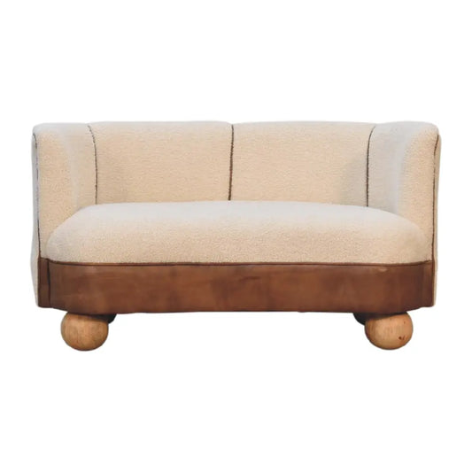 Boucle cream buffalo small sofa with plush cream fabric, brown leather base, and rounded wooden legs small sofa design