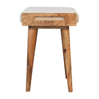 A boucle cream tray style footstool with a cream tray boucle upholstered seat and rustic wooden tapered legs