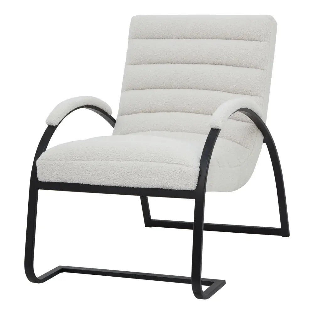 Cream-colored boucle ribbed ark chair with plush upholstery black metal frame and curved arms for cozy seating