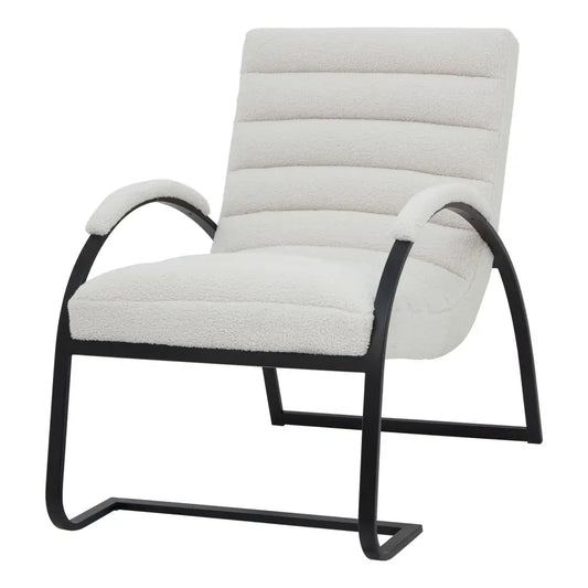 Cream-colored boucle ribbed ark chair with plush upholstery black metal frame and curved arms for cozy seating