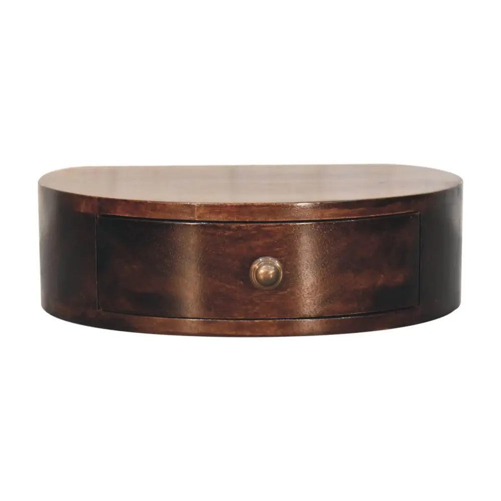 Dark brown oval shaped wooden desk with single drawer and brass knob in california walnut wall mounted bedside style