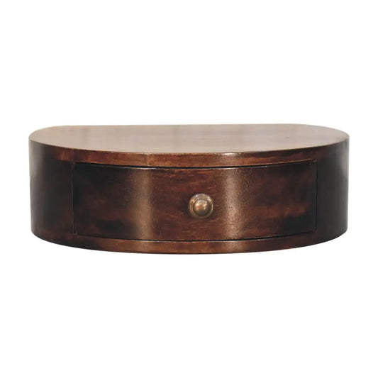 Dark brown oval shaped wooden desk with single drawer and brass knob in california walnut wall mounted bedside style