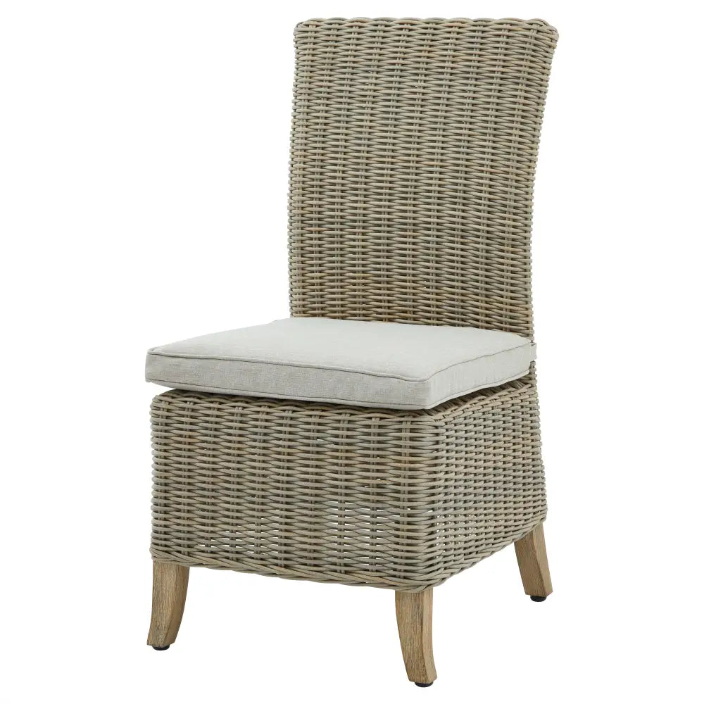 Beige wicker outdoor dining chair with light gray cushion and natural wood legs from capri collection