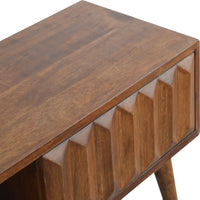A mid-century modern wooden media unit with rich brown finish and geometric angular paneling in prism sliding media style