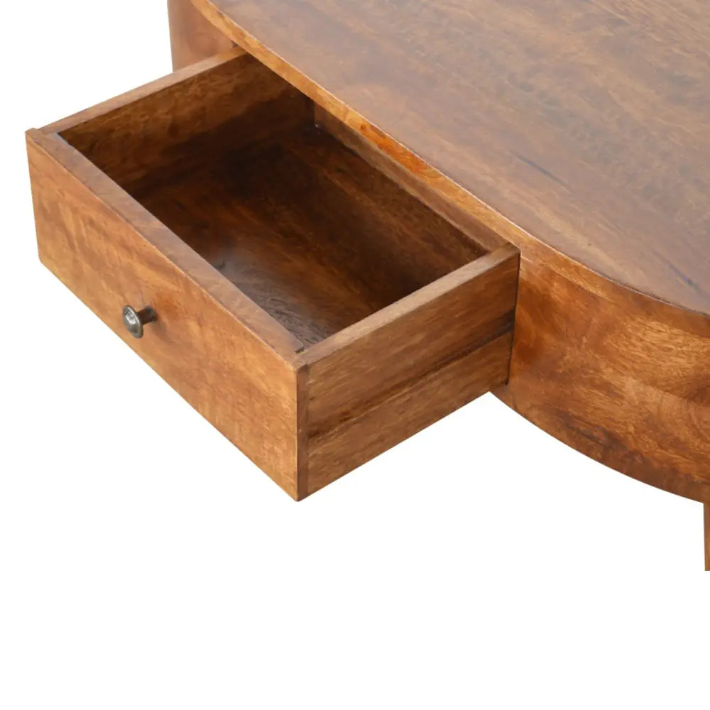 Chestnut rounded coffee table with warm-toned wood curved top and open drawer with metallic knob perfect as a coffee table