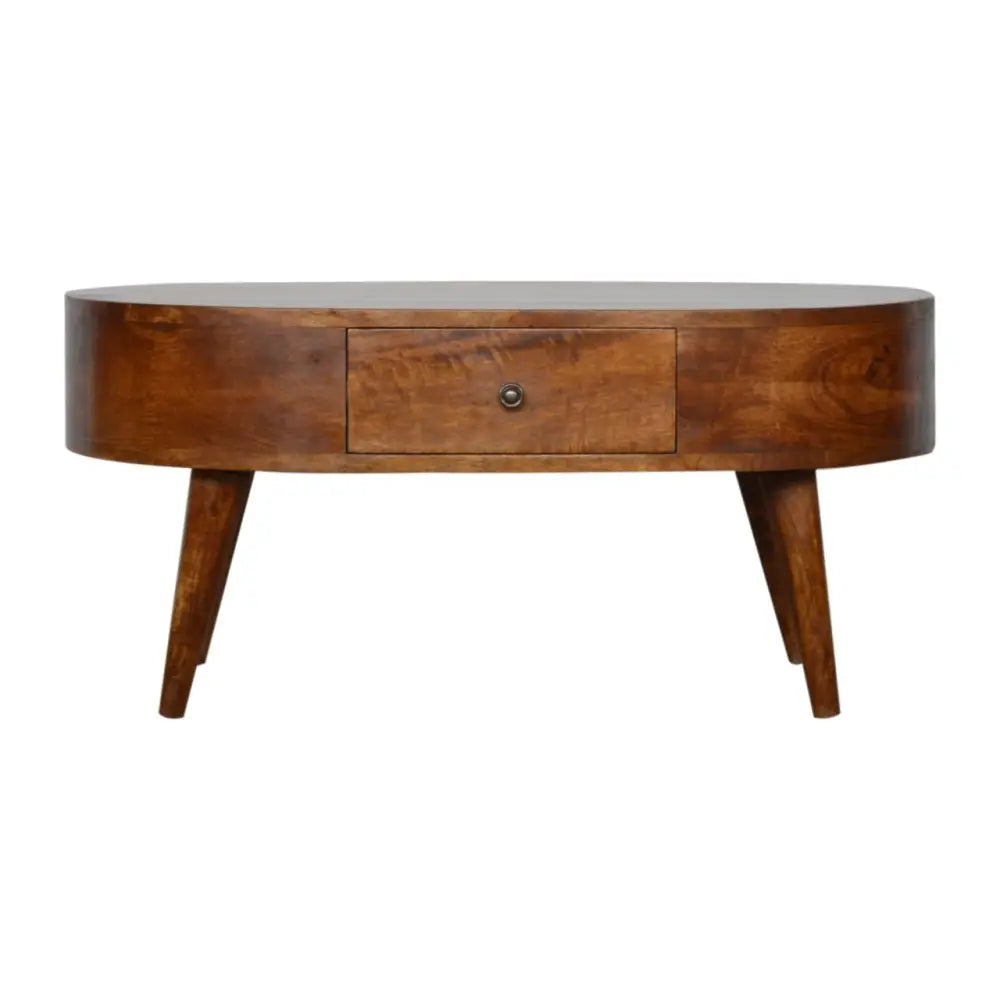 A sleek chestnut rounded coffee table with an oval wooden top, single drawer, and tapered legs perfect for any room