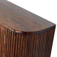 Dark brown chunky chestnut wall mounted console with vertical ribbed paneling and curved top edge in wood