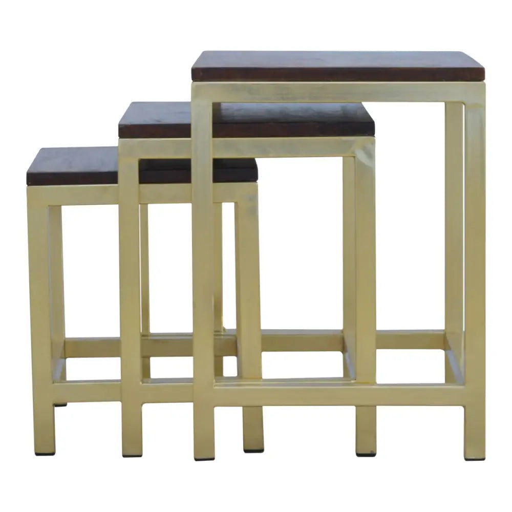 Set of three chunky gold stools with gold metal frames and dark wood tops perfect as a stylish stool set