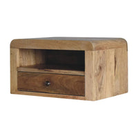 Light brown chunky oak-ish floating bedside with single drawer open shelf and dark metal knob showing natural wood grain