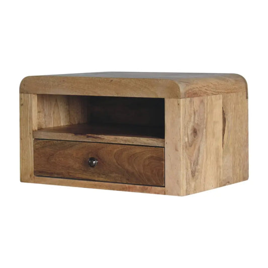 Light brown chunky oak-ish floating bedside with single drawer open shelf and dark metal knob showing natural wood grain