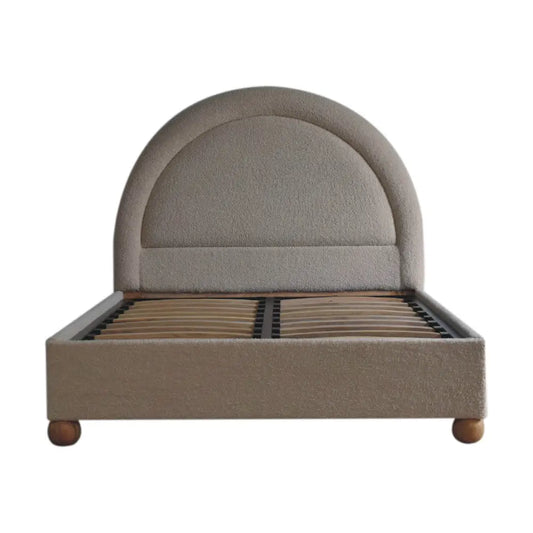 Cream boucle double bed with beige upholstery curved headboard and wooden legs for cozy bedroom style