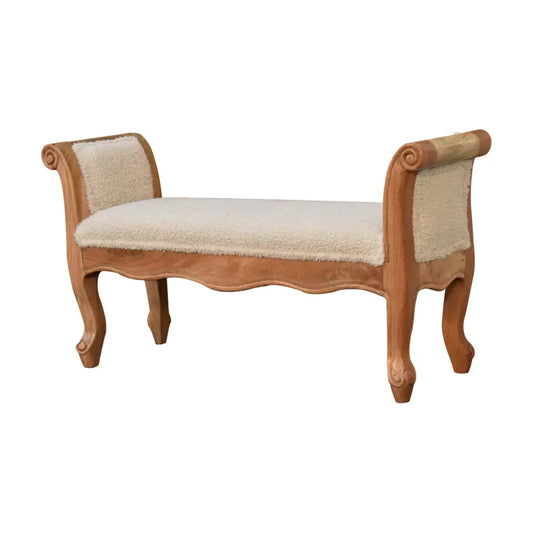 Beige upholstered bench with carved light wood frame and scrolled legs in cream boucle french style design