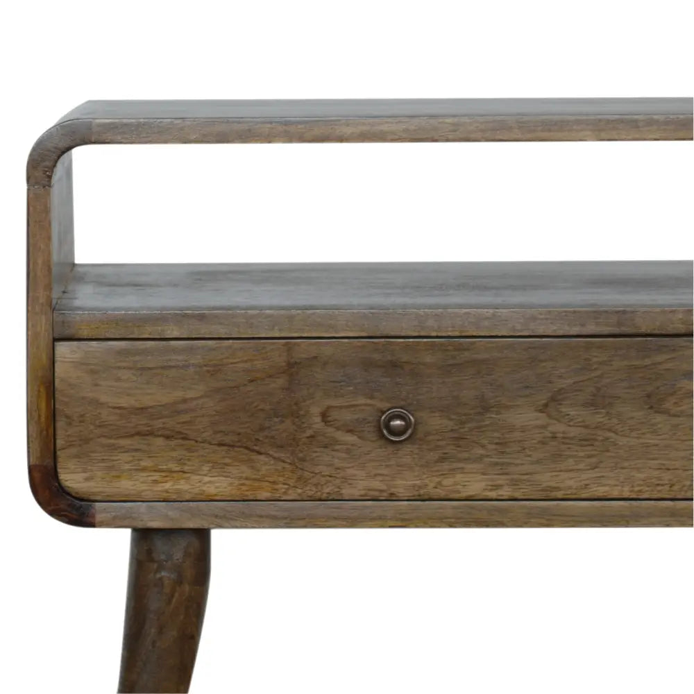 A rustic wooden console table with a dark brown finish, curved legs, and single drawer matching curved grey wash style