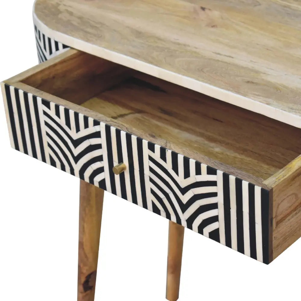 A modern edessa bone inlay console table with natural wood top black and white geometric bone inlay drawer front