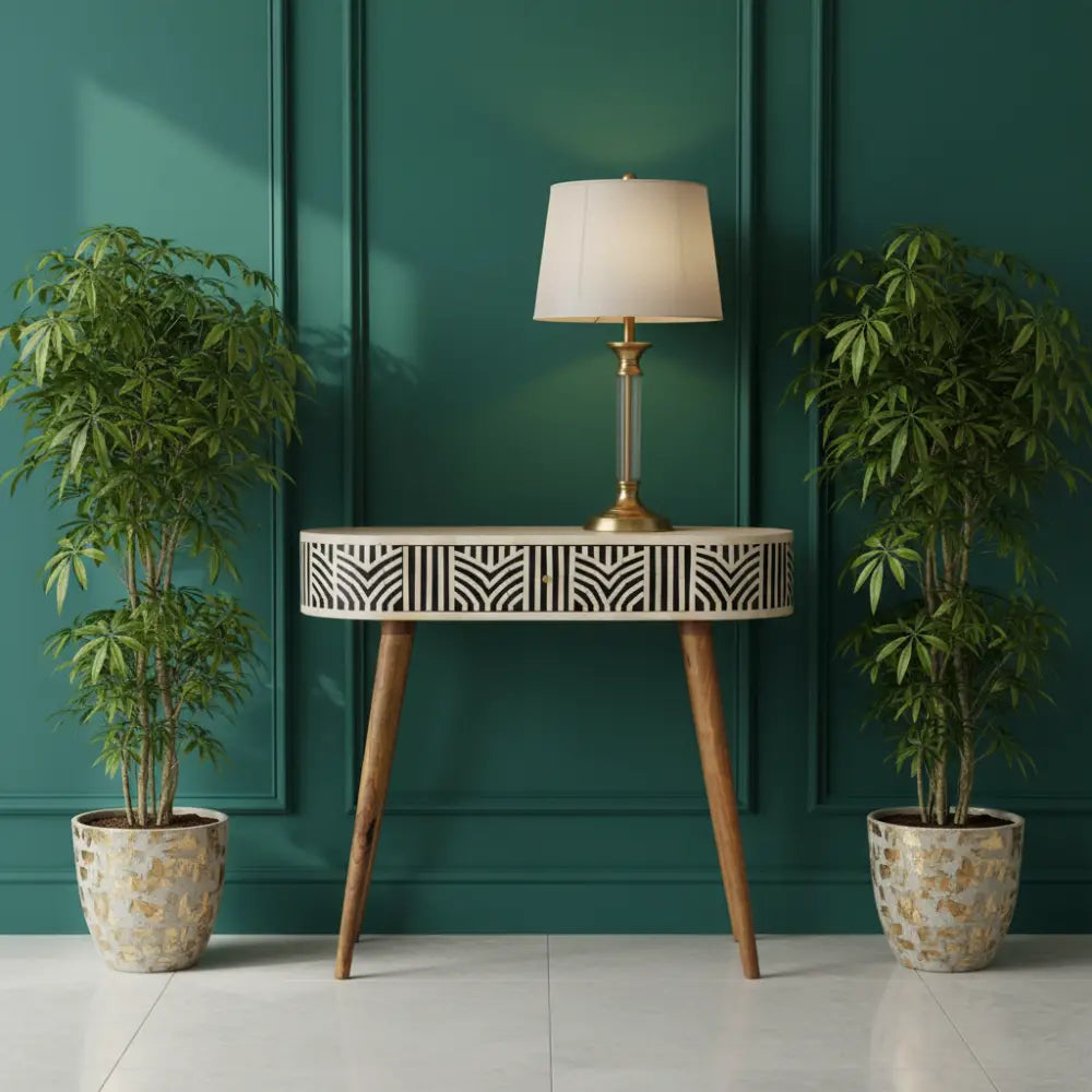 A sleek edessa bone inlay console table with a white and black geometric bone inlay top and wooden angled legs
