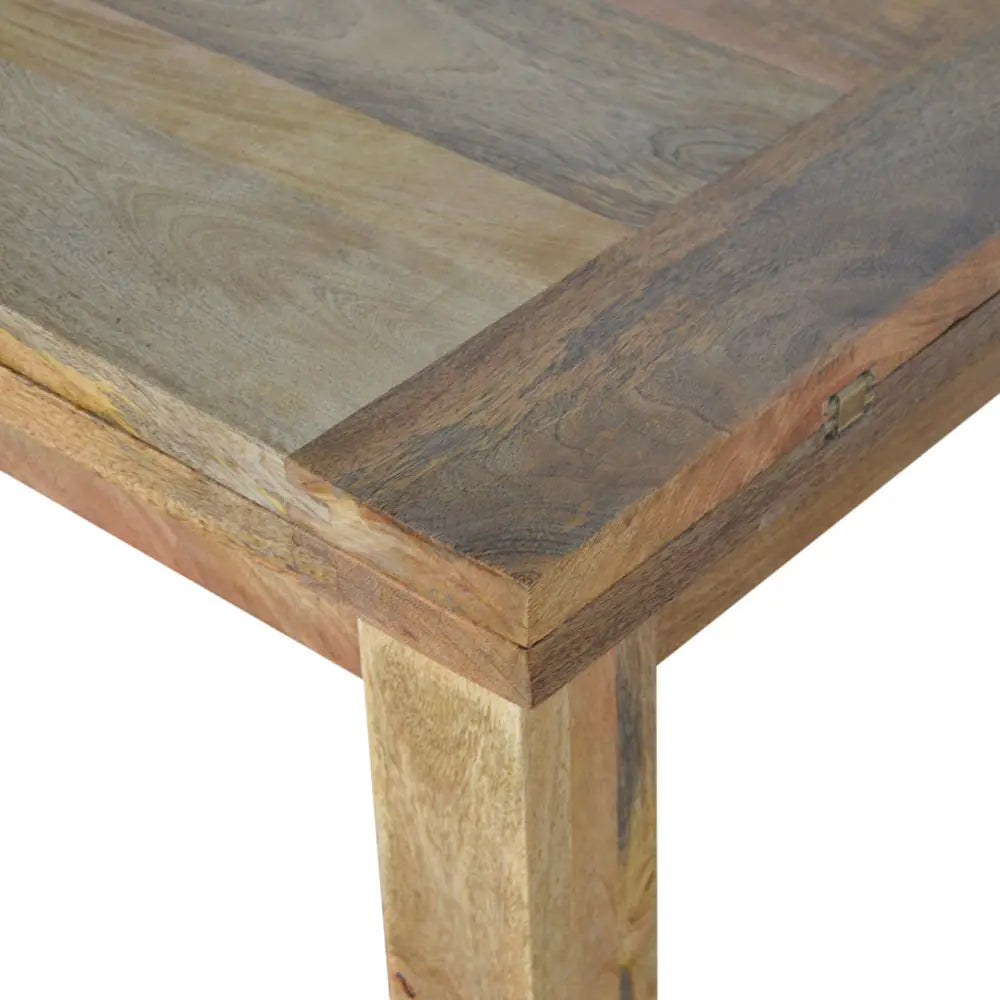 Rustic wooden extendable butterfly dining table with patchwork top in natural tones and sturdy thick legs