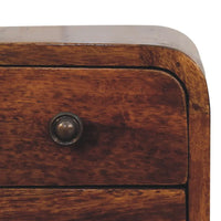 Dark brown wooden drawer with round metallic knob on extra mini curved chestnut bedside chest
