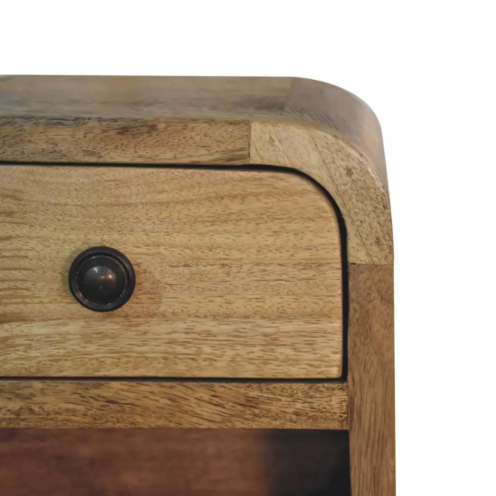 Extra mini curved oak-ish wooden nightstand with light brown finish and dark metal drawer knob for bedside use