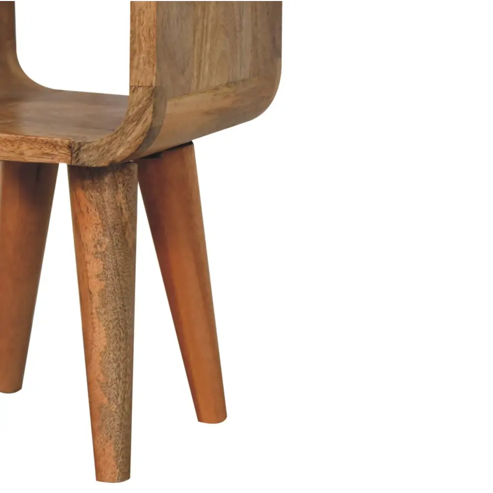 A mid-century modern extra mini minimalist wooden side table with warm oak finish and curved legs for bedside use