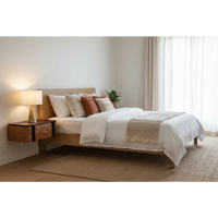 A minimalist wooden bed with a simple headboard and matching nightstand in light natural solid mango wood finish