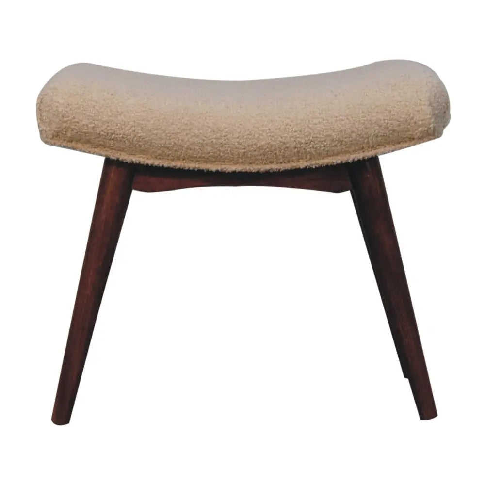 Beige upholstered curved bench footstool with honey caramel boucle fabric and dark wood legs for stylish seating