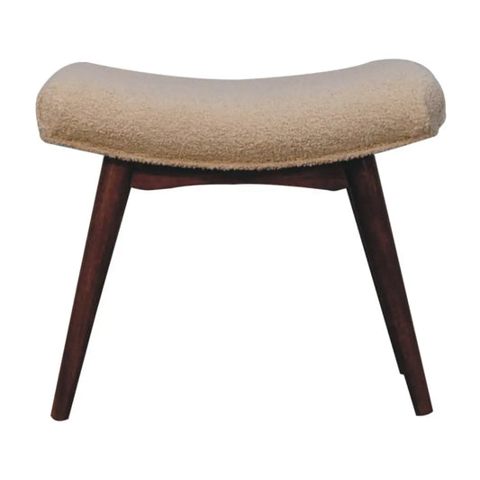 Beige upholstered curved bench footstool with honey caramel boucle fabric and dark wood legs for stylish seating