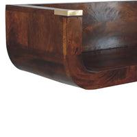 Dark brown wooden chestnut floating console with curved front and brass corner accents for stylish storage