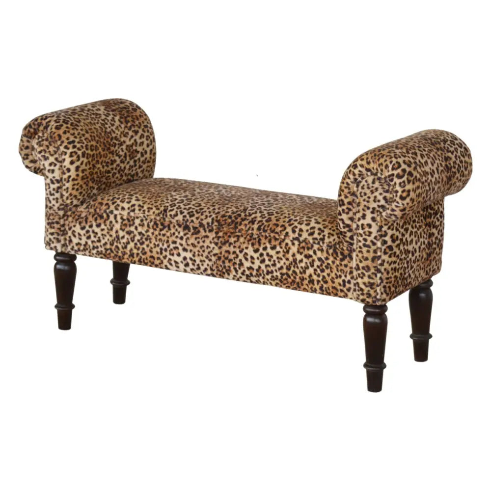 Leopard print velvet bench with rolled arms and dark wooden legs upholstered in soft leopard print velvet
