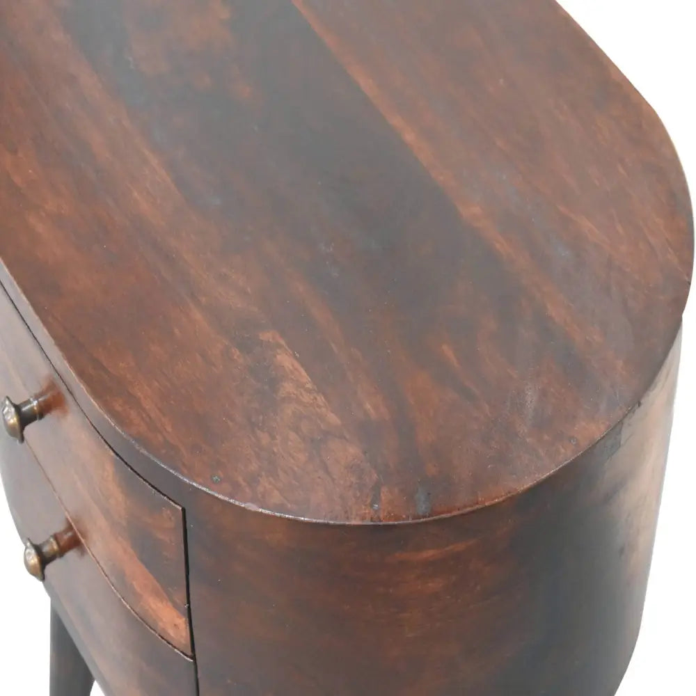 Dark brown wooden bedside table with curved edges and brass handles, styled as a light walnut rounded bedside table