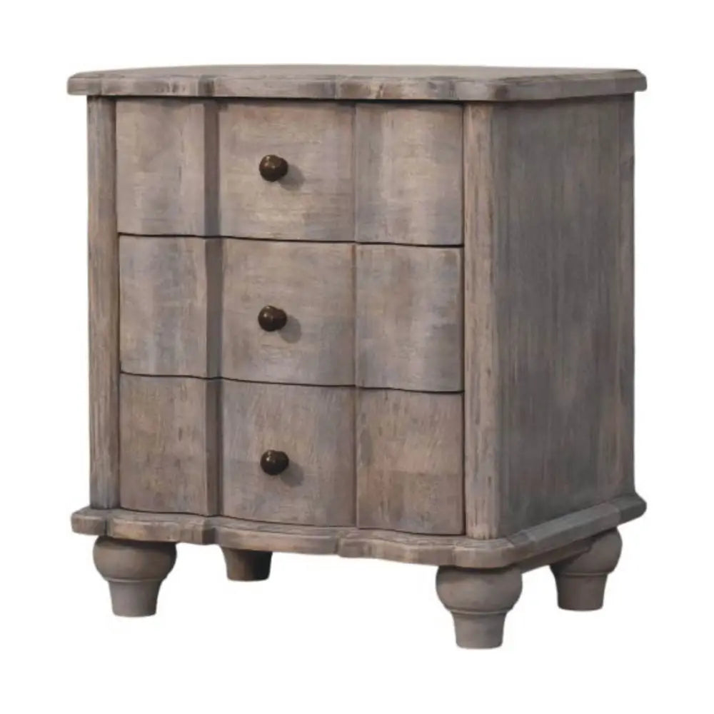 Gray distressed lume washed bedside table in solid mango wood with three drawers and dark round knobs