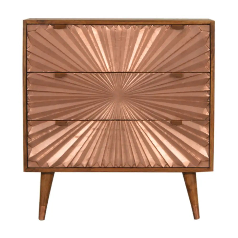 Copper finished three drawer chest with sunburst embossed panels and wooden legs called manila copper chest